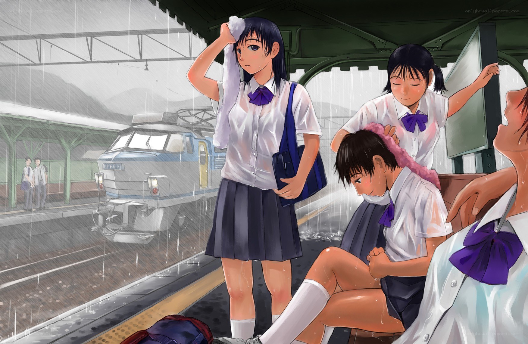 Students at a rainy train station