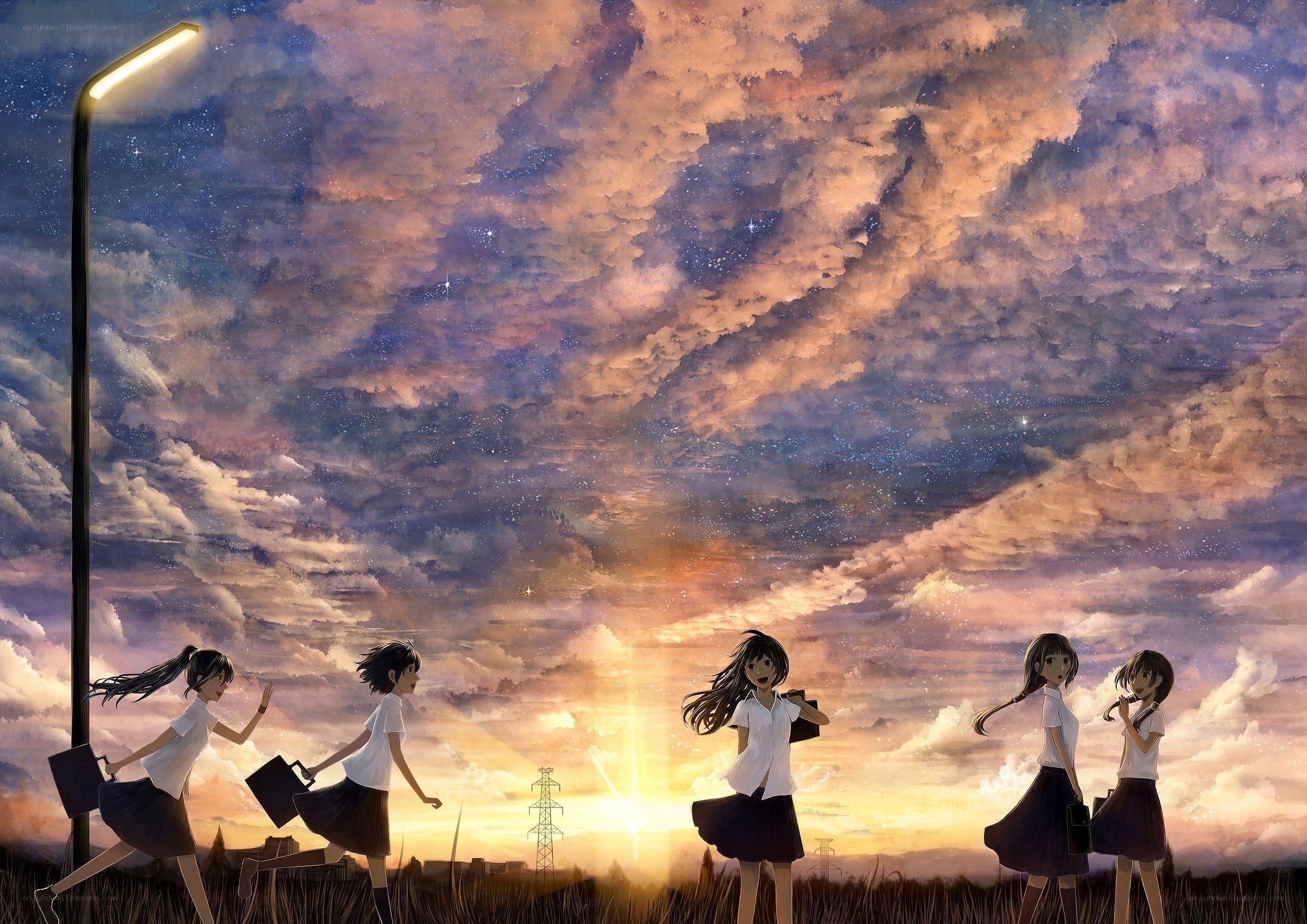 Students at sunset with starry sky