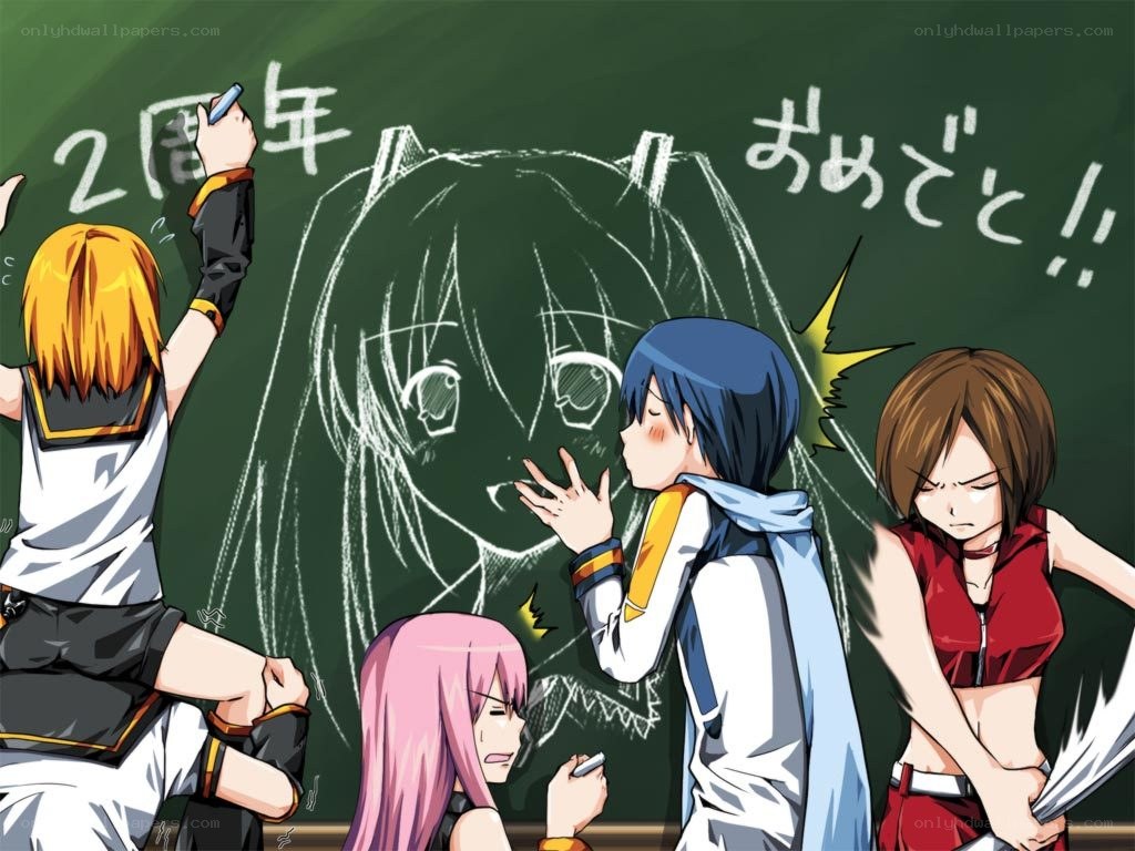 Students drawing on chalkboard