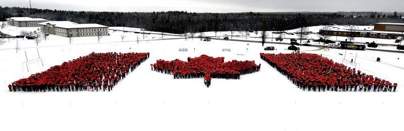 Students forming a maple leaf