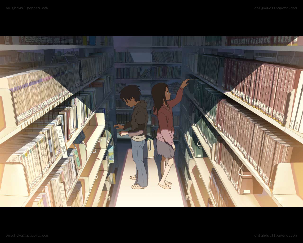 Students in a library aisle