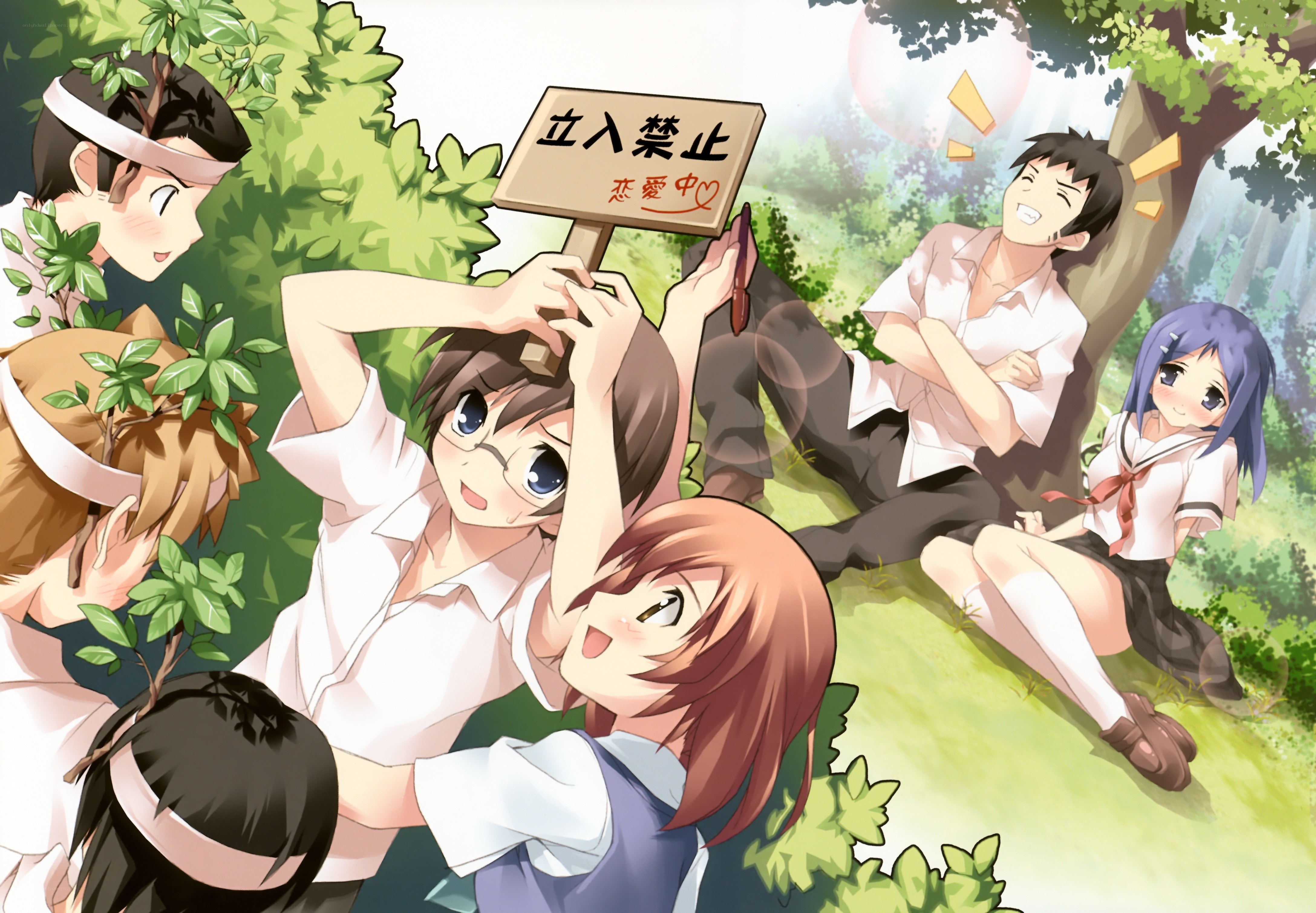 Students in a park with sign