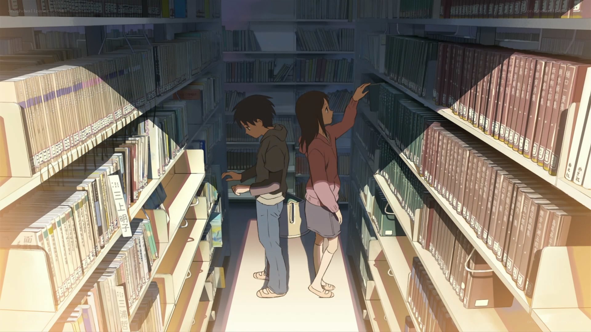 Students in library aisle