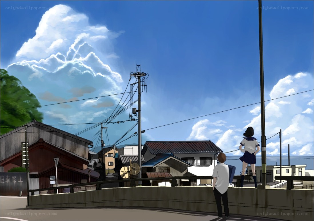 Students on a bridge overlooking the town