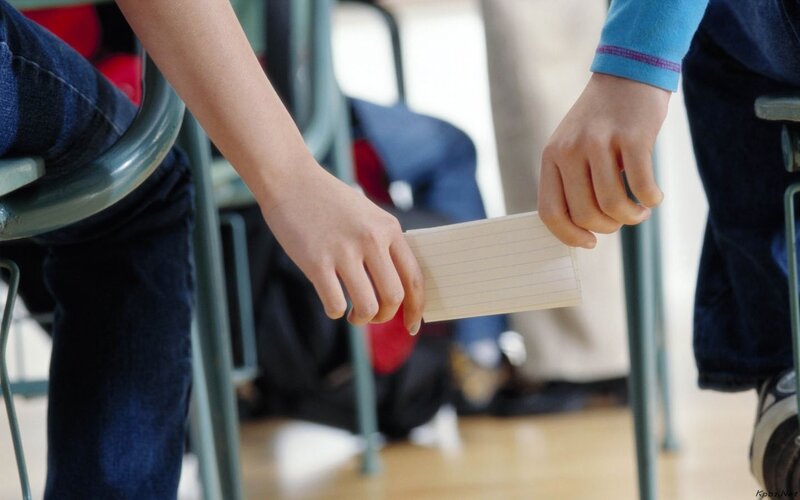 Students passing a note