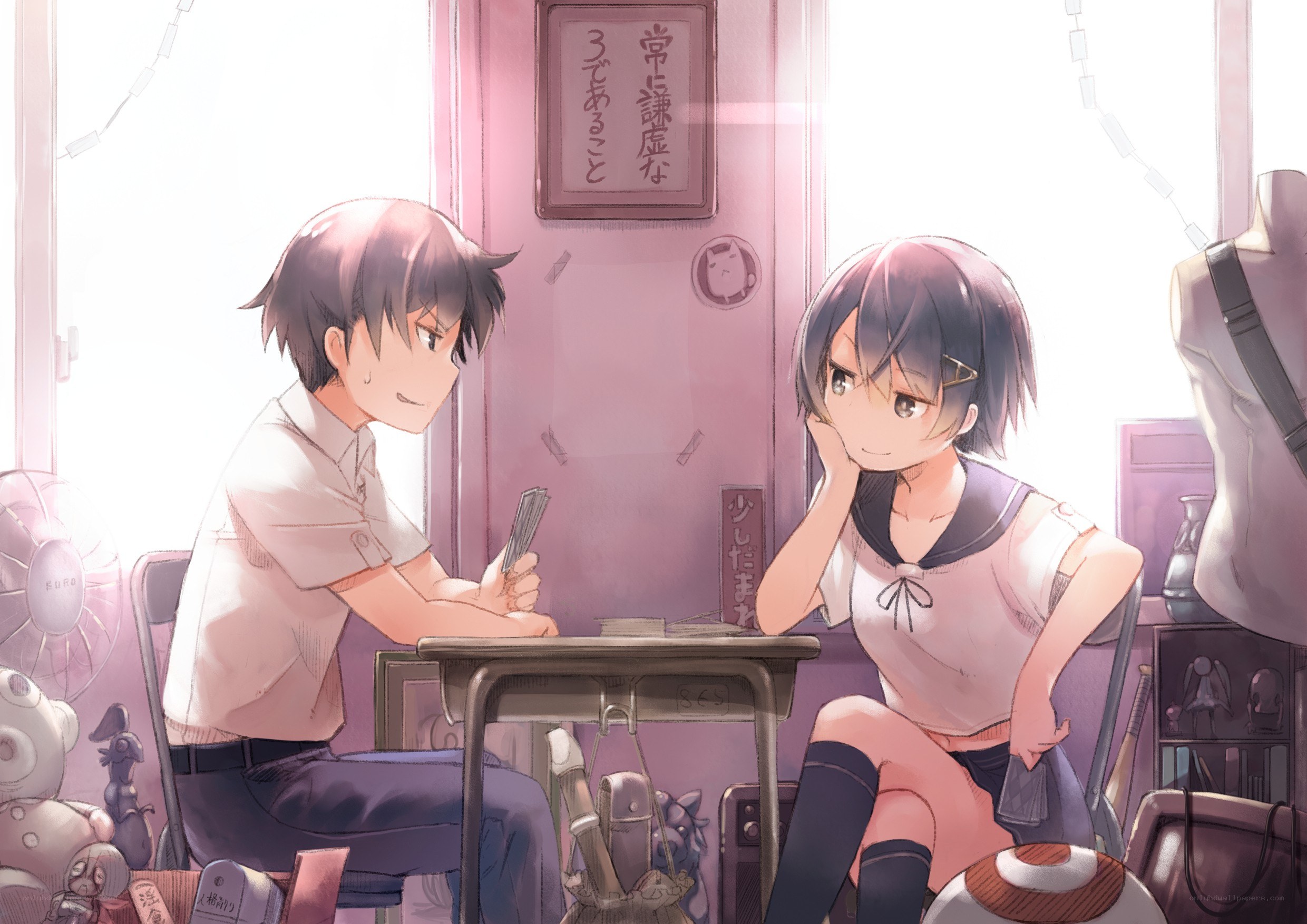 Students playing cards in a classroom