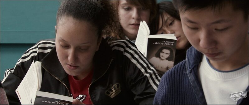Students reading Anne Frank's diary
