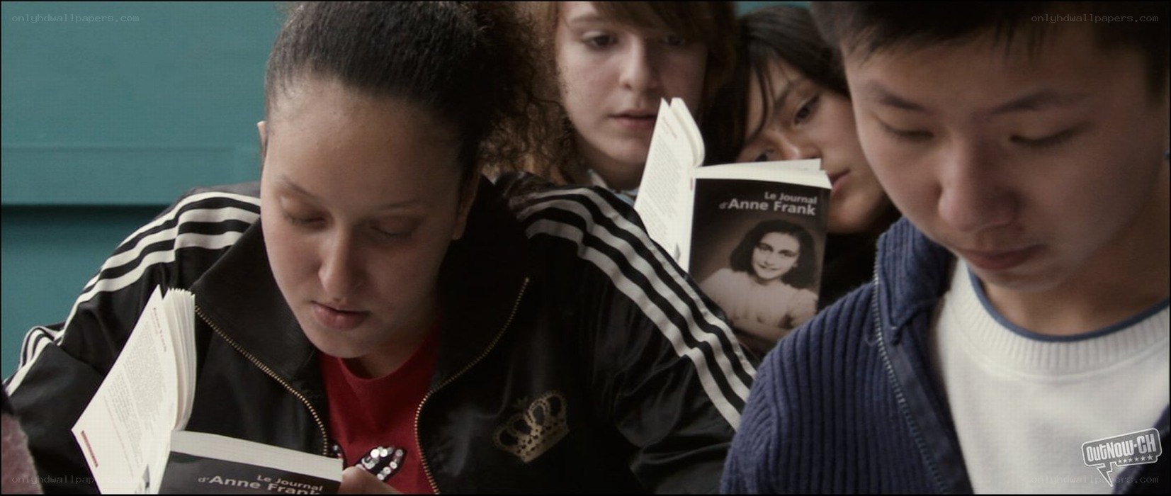 Students reading Anne Frank's diary