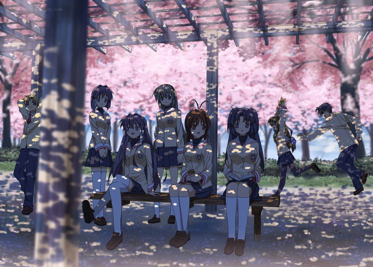 Students under a cherry blossom trellis