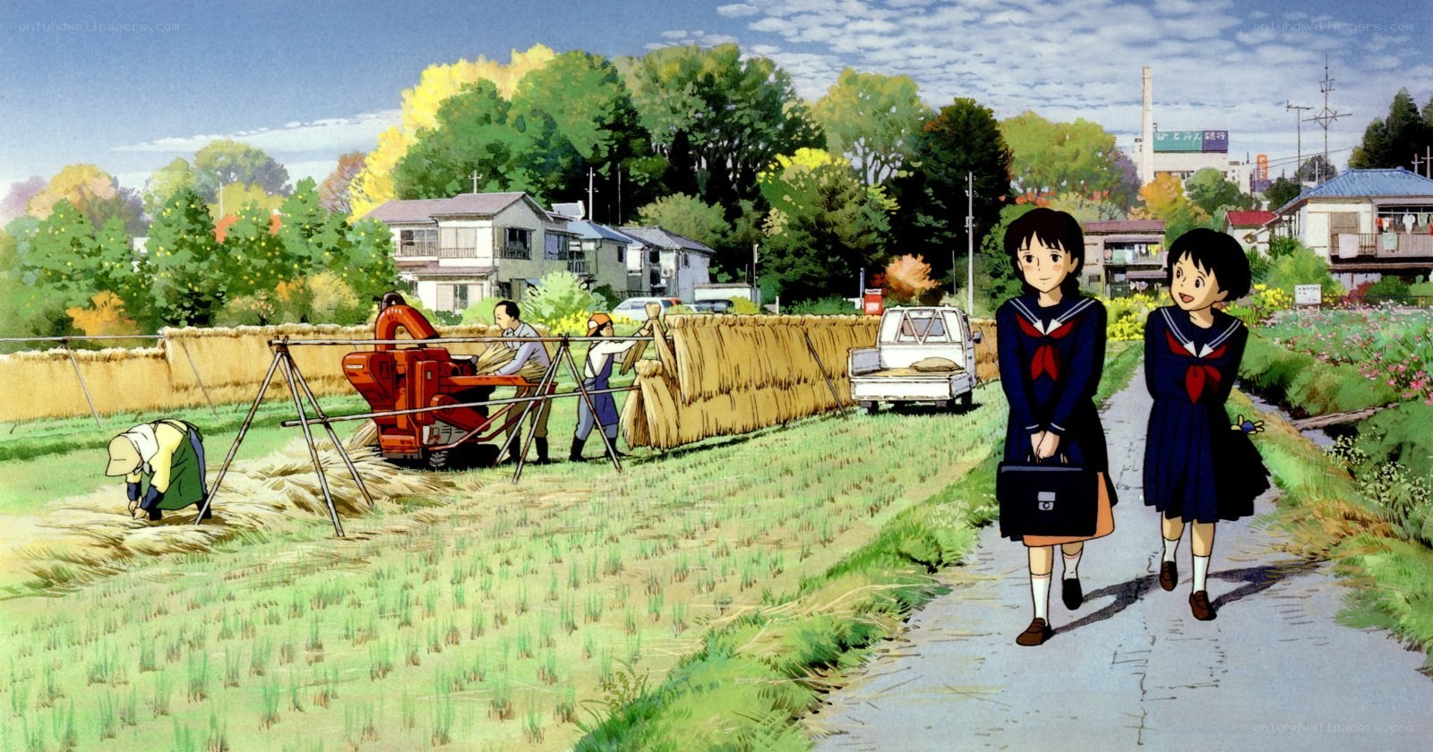 Students walking past a harvest scene
