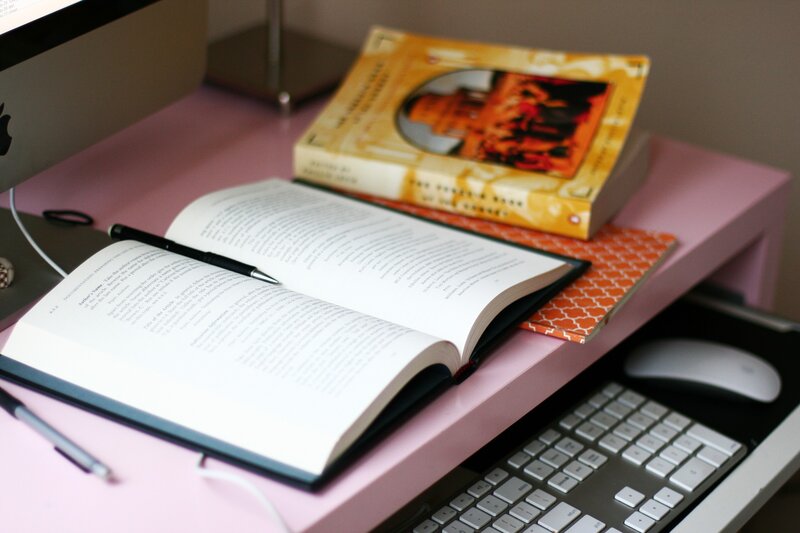 study desk with books and computer