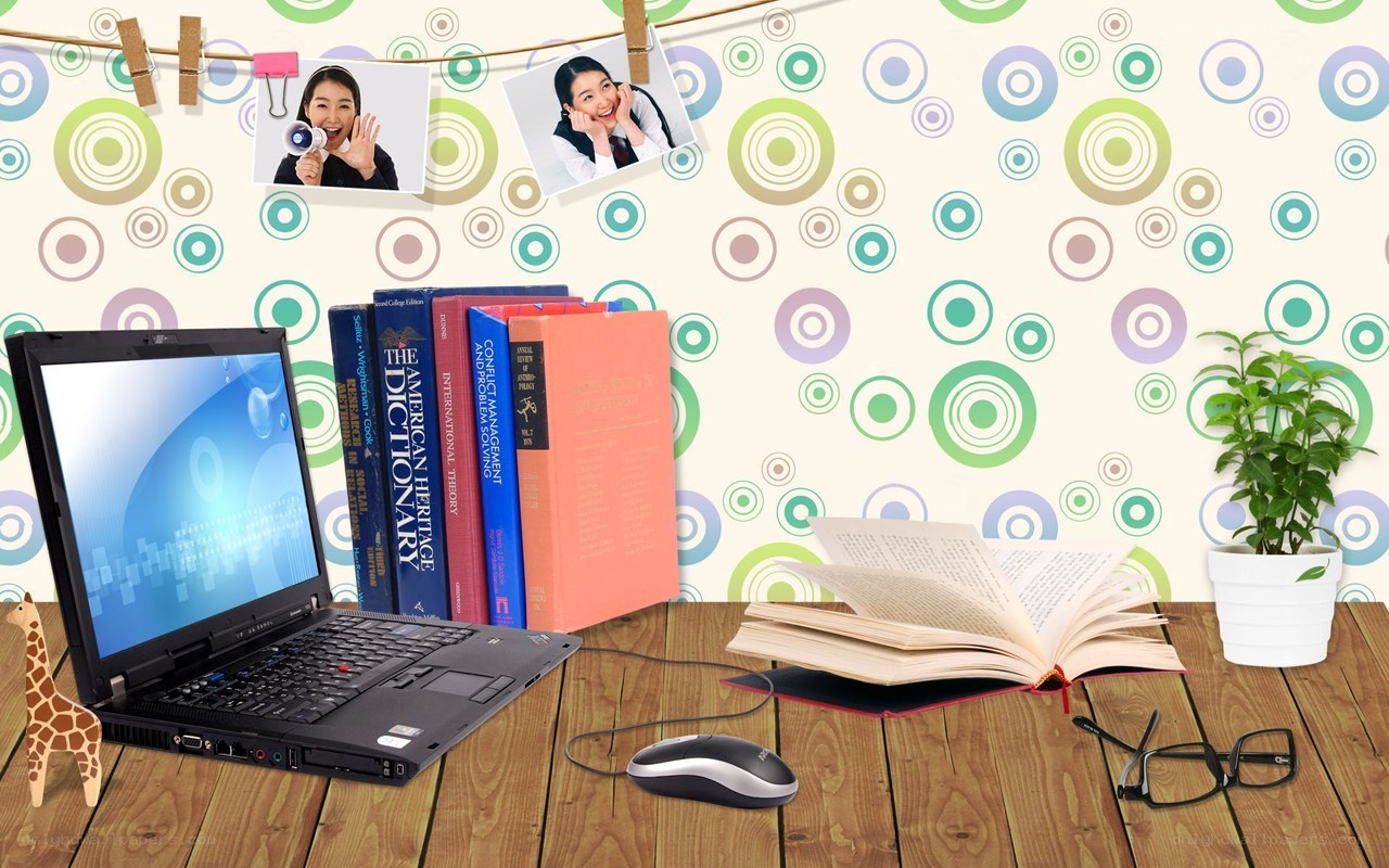 study desk with laptop and books