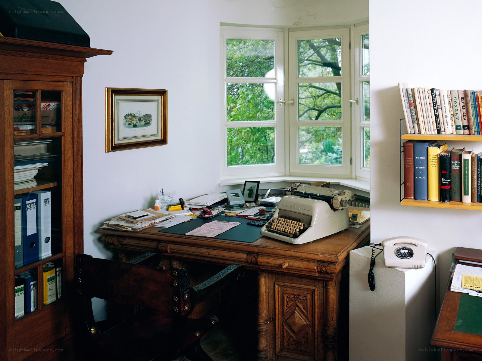 study with typewriter and books