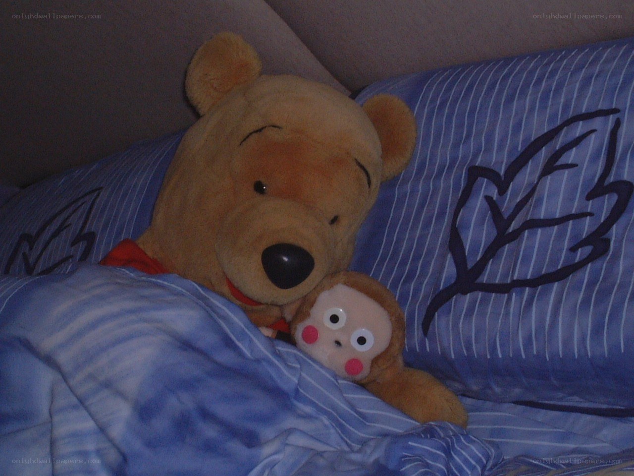 Stuffed animals in bed