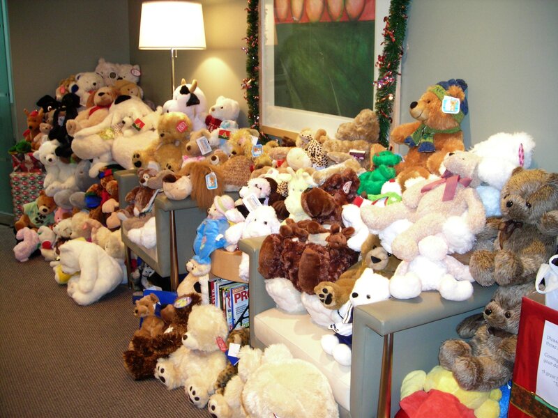 Stuffed animals piled on furniture