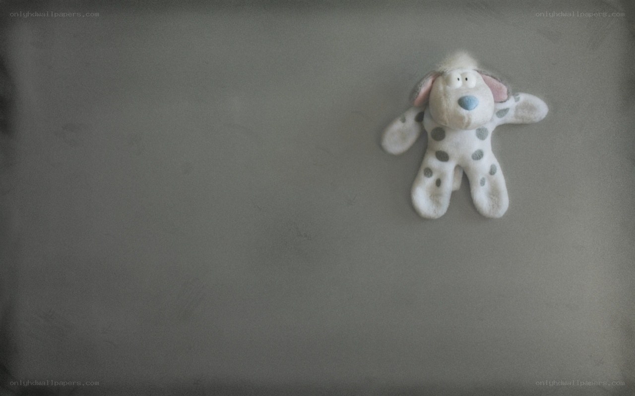 Stuffed dog toy on gray surface