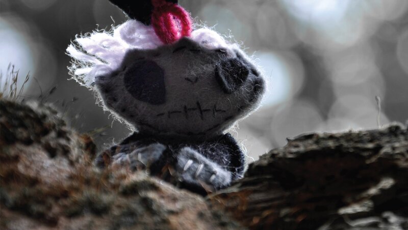 Stuffed toy on a log