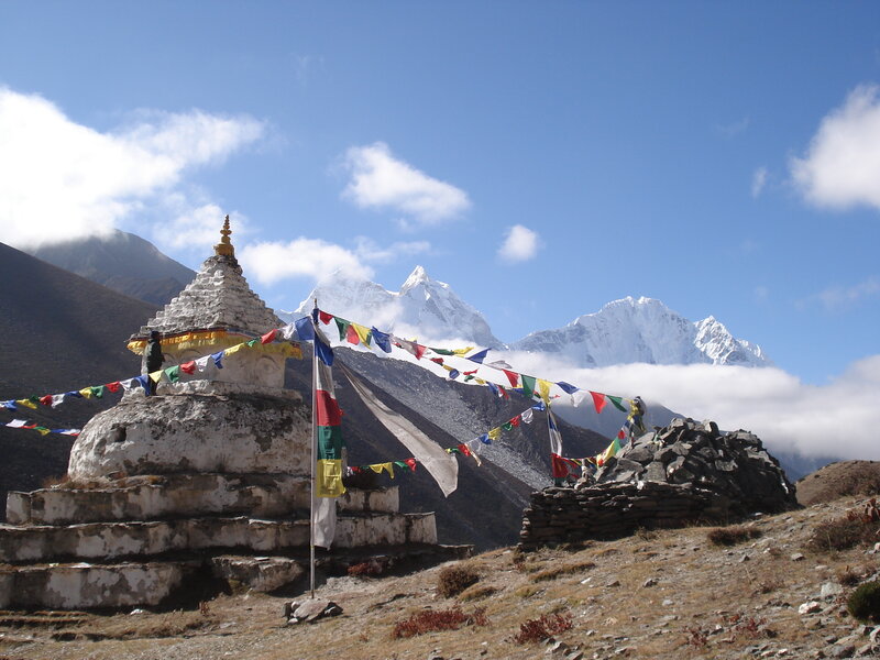 Stupa with prayer flags in mountains