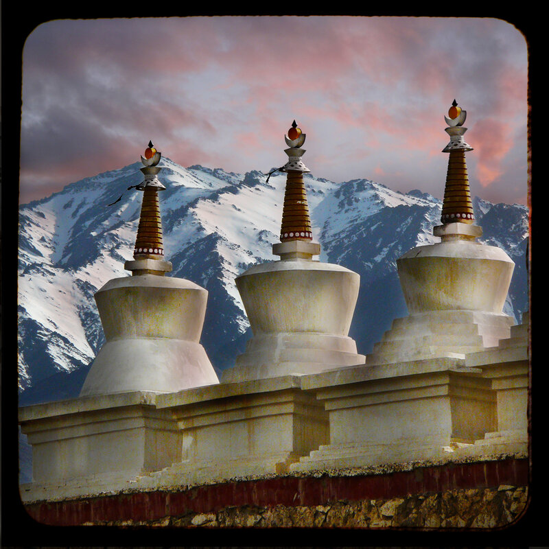 Stupas with mountain backdrop
