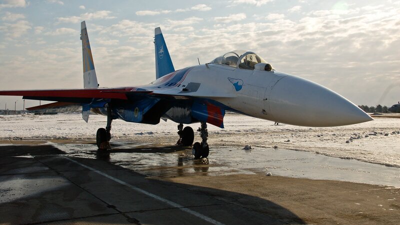 Su-27 fighter jet on snowy tarmac
