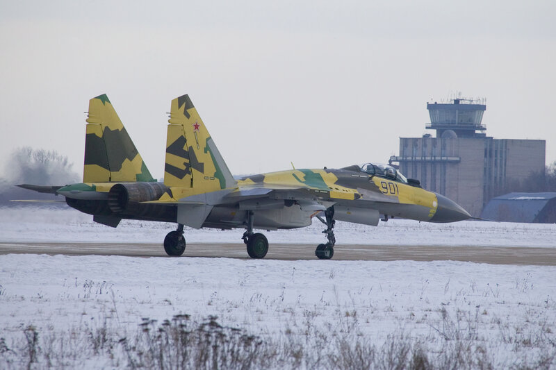 Su-30 fighter jet on snowy runway