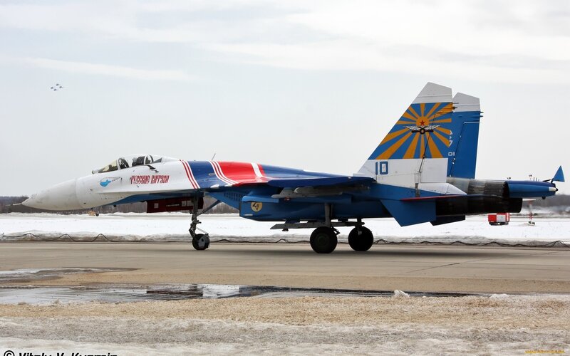 Su-30 jet on snowy tarmac