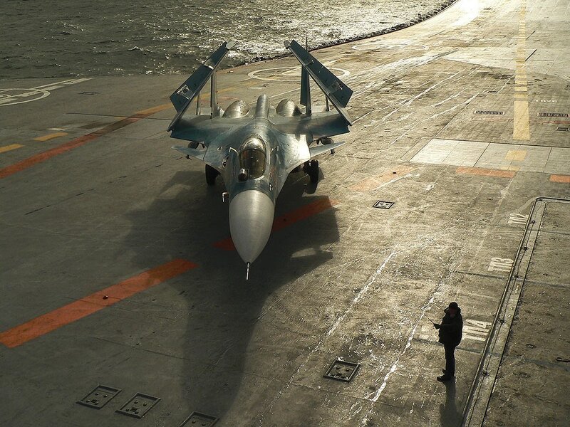Su-33 fighter on aircraft carrier deck