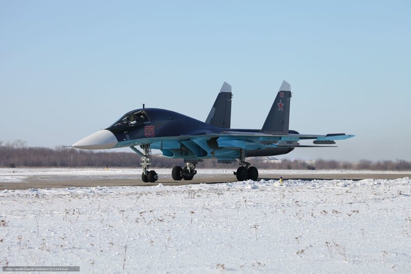 Su-34 fighter jet on snowy runway