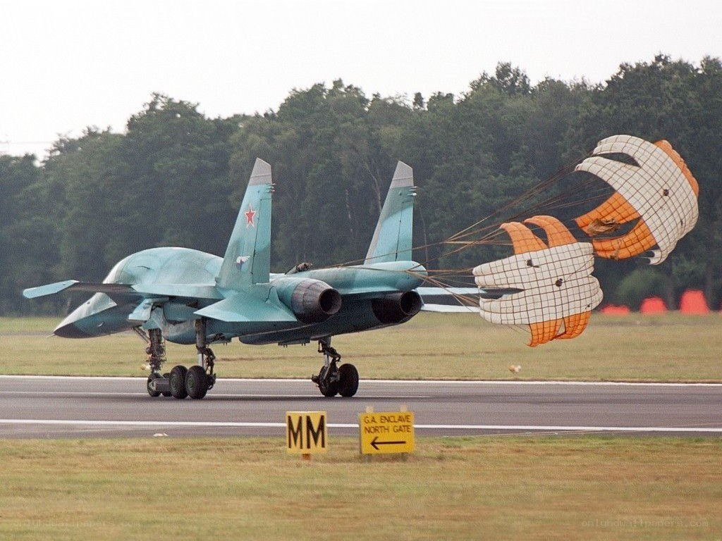 Su-37 jet with parachutes