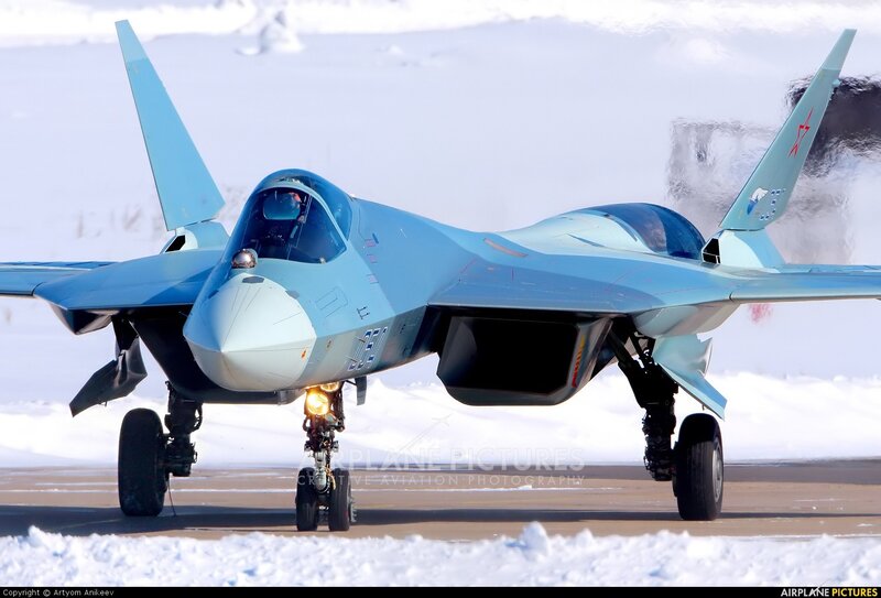 Su-57 fighter jet on snowy runway