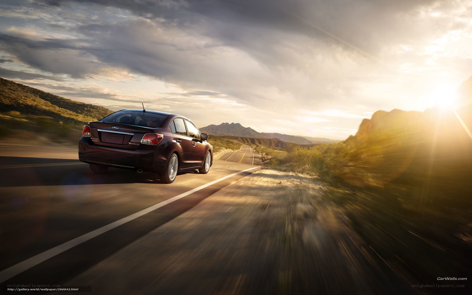 Subaru driving on a desert road