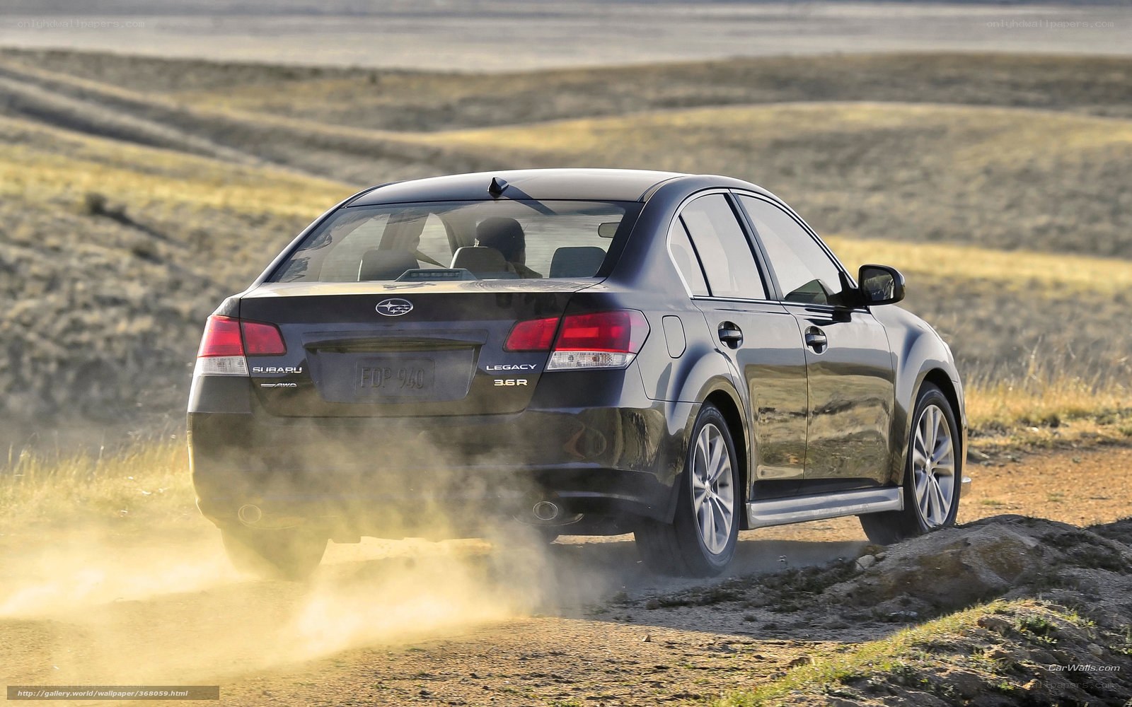Subaru Legacy on dirt road