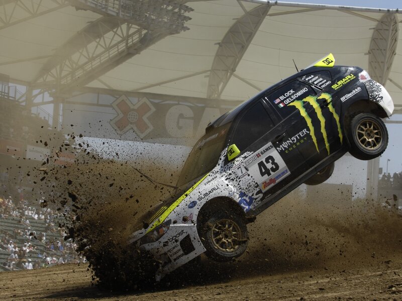 Subaru rally car in mid-air jump