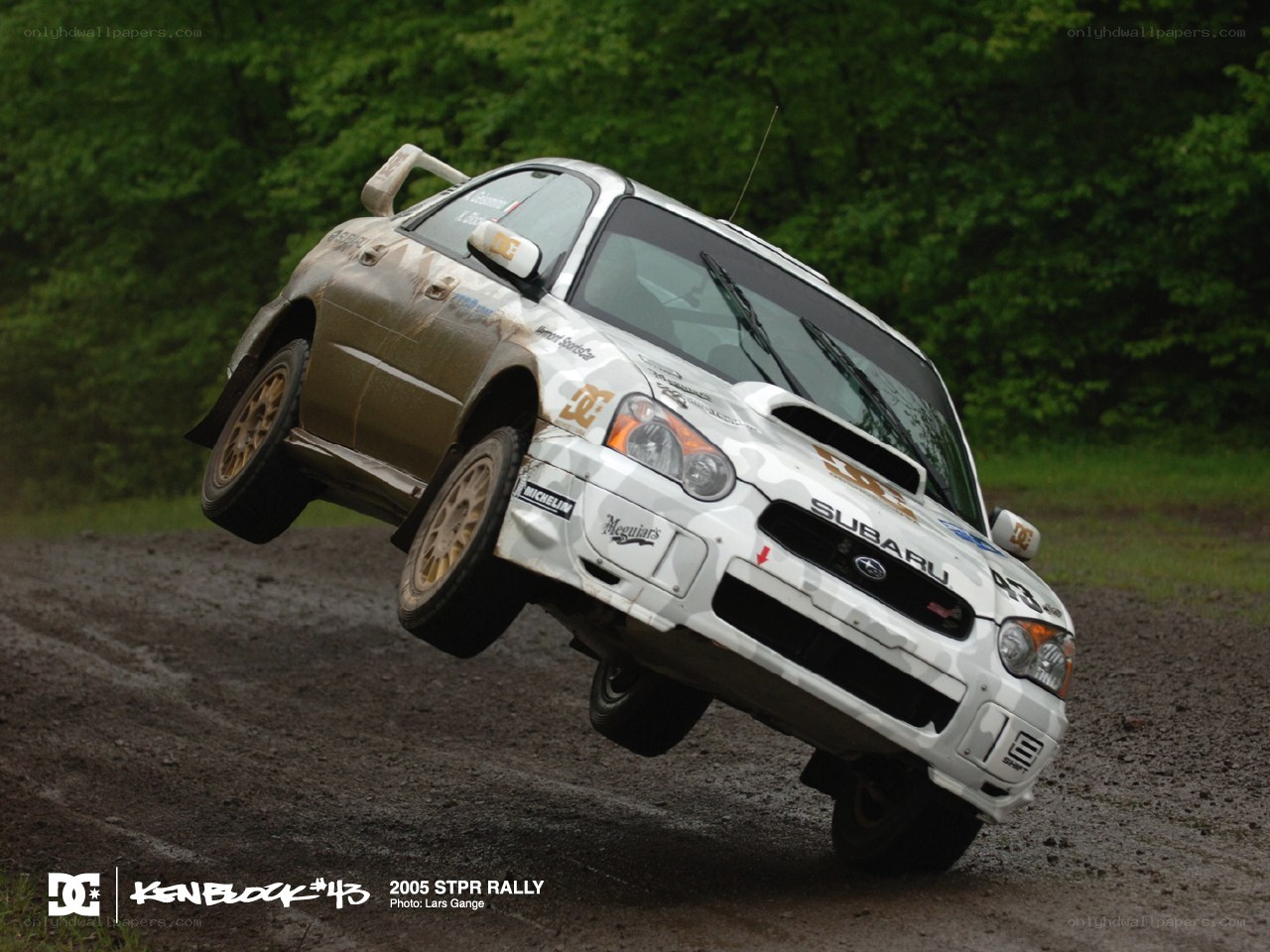 Subaru rally car in mid-air