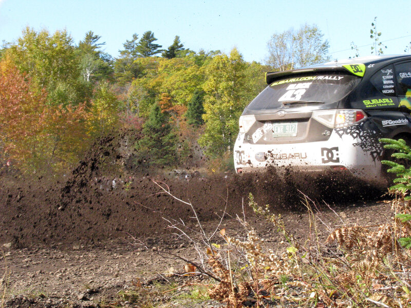 Subaru rally car kicking up dirt