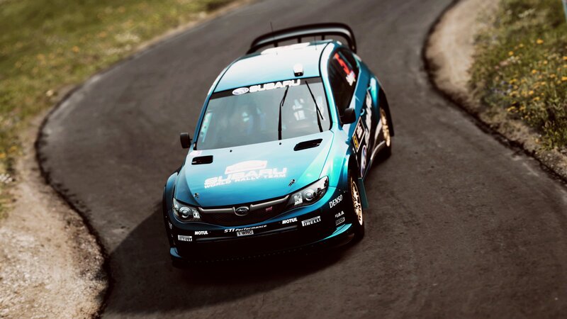 Subaru rally car on a winding road