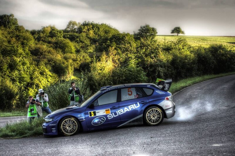 Subaru rally car on a winding road