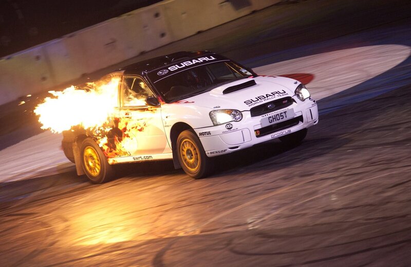 Subaru rally car on fire