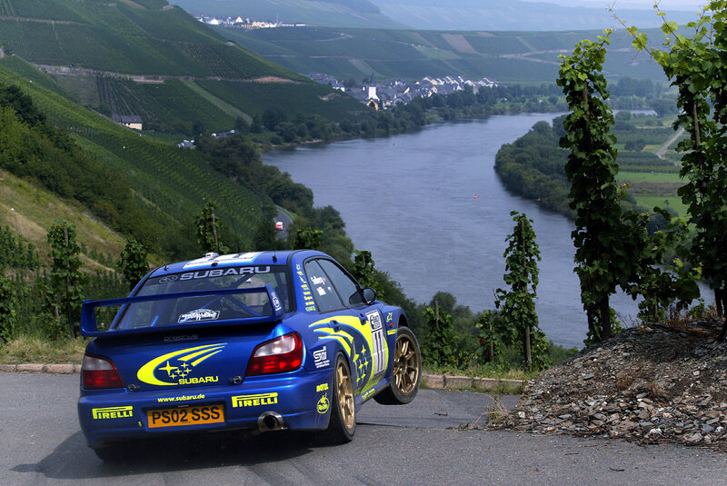 Subaru rally car on river road