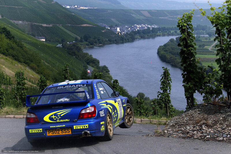 Subaru rally car on river road