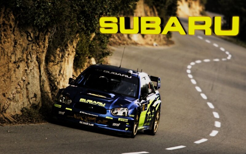 Subaru rally car on winding road