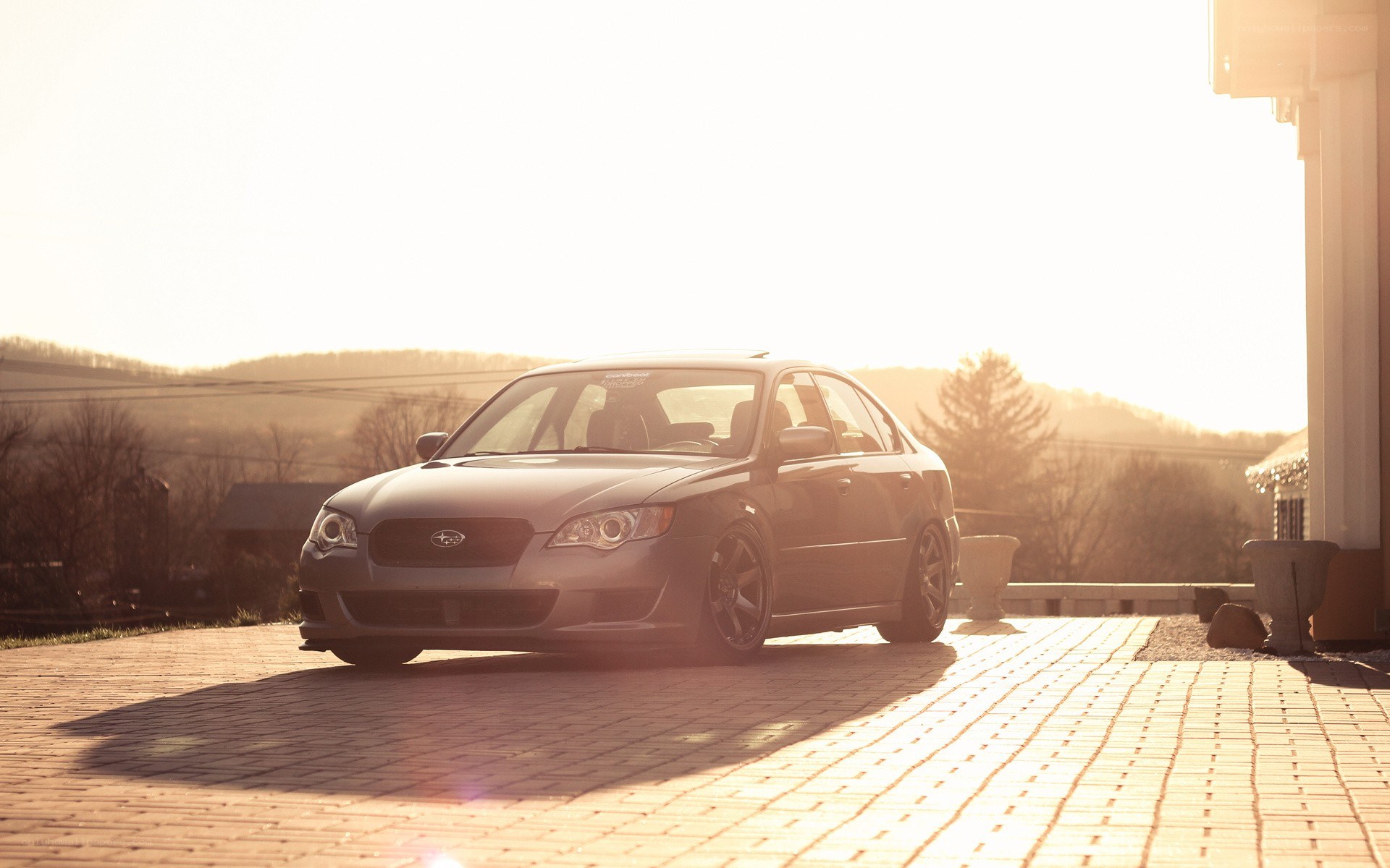 Subaru sedan at sunset