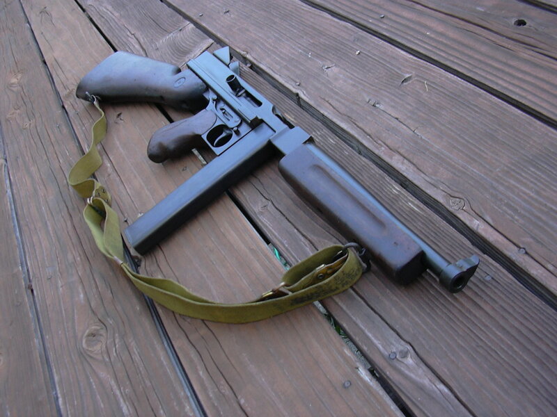 Submachine gun on wooden deck