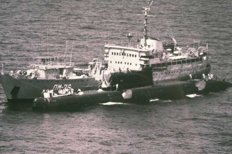 Submarine and support vessel at sea