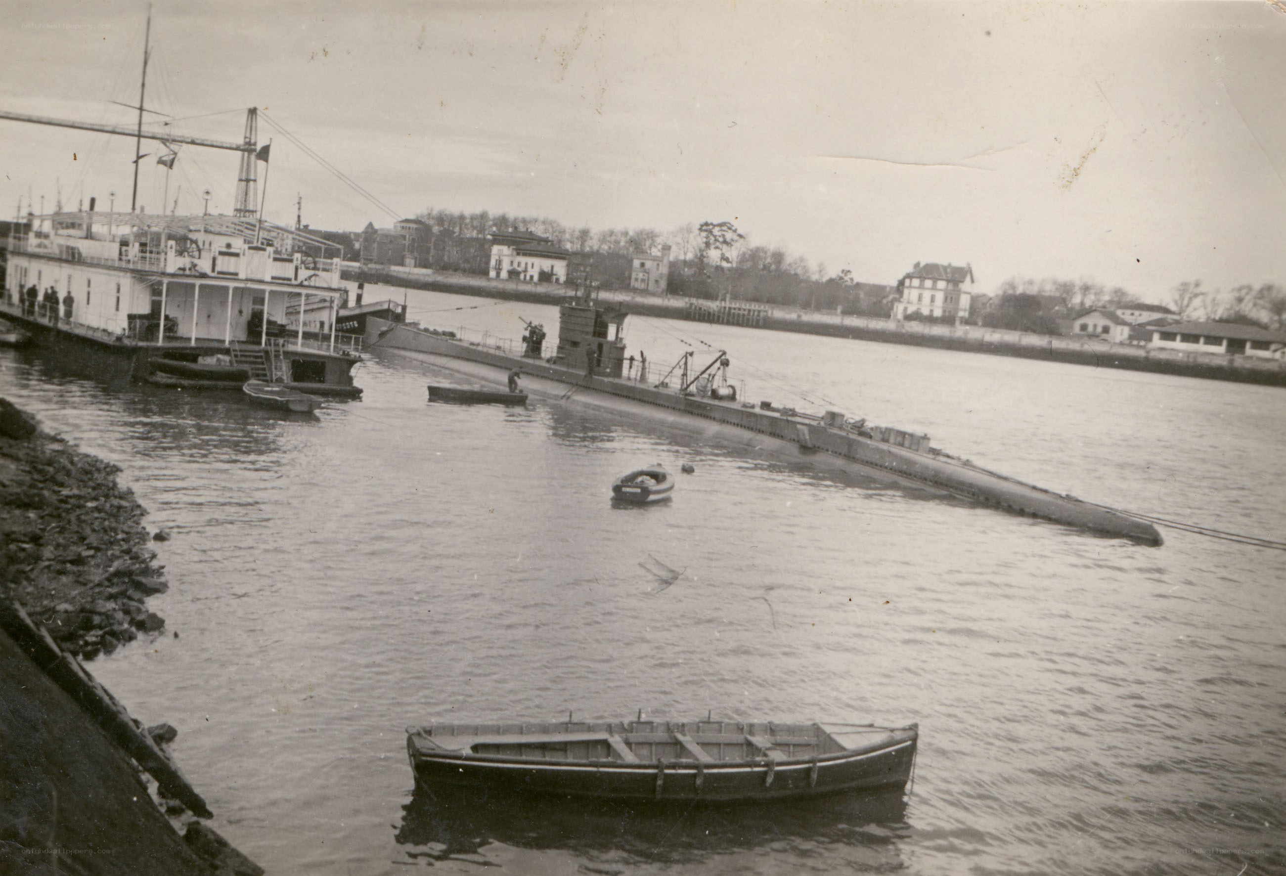 Submarine at dock in harbor