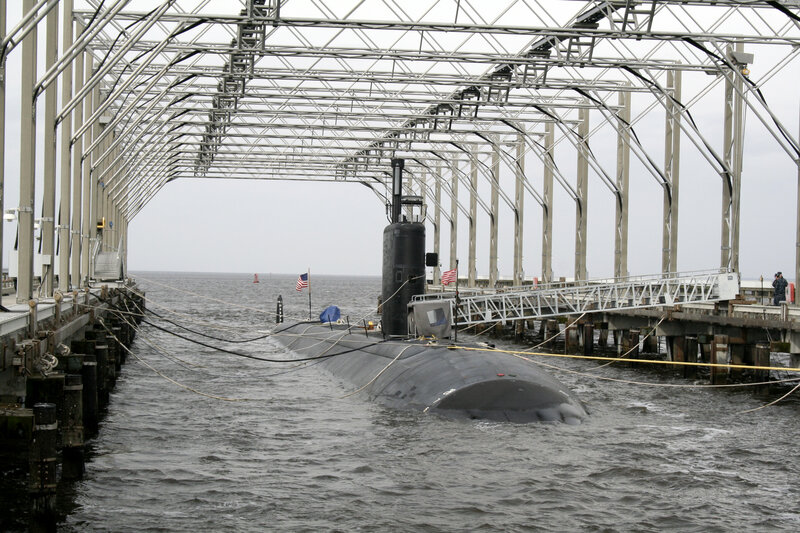 Submarine at docked pier