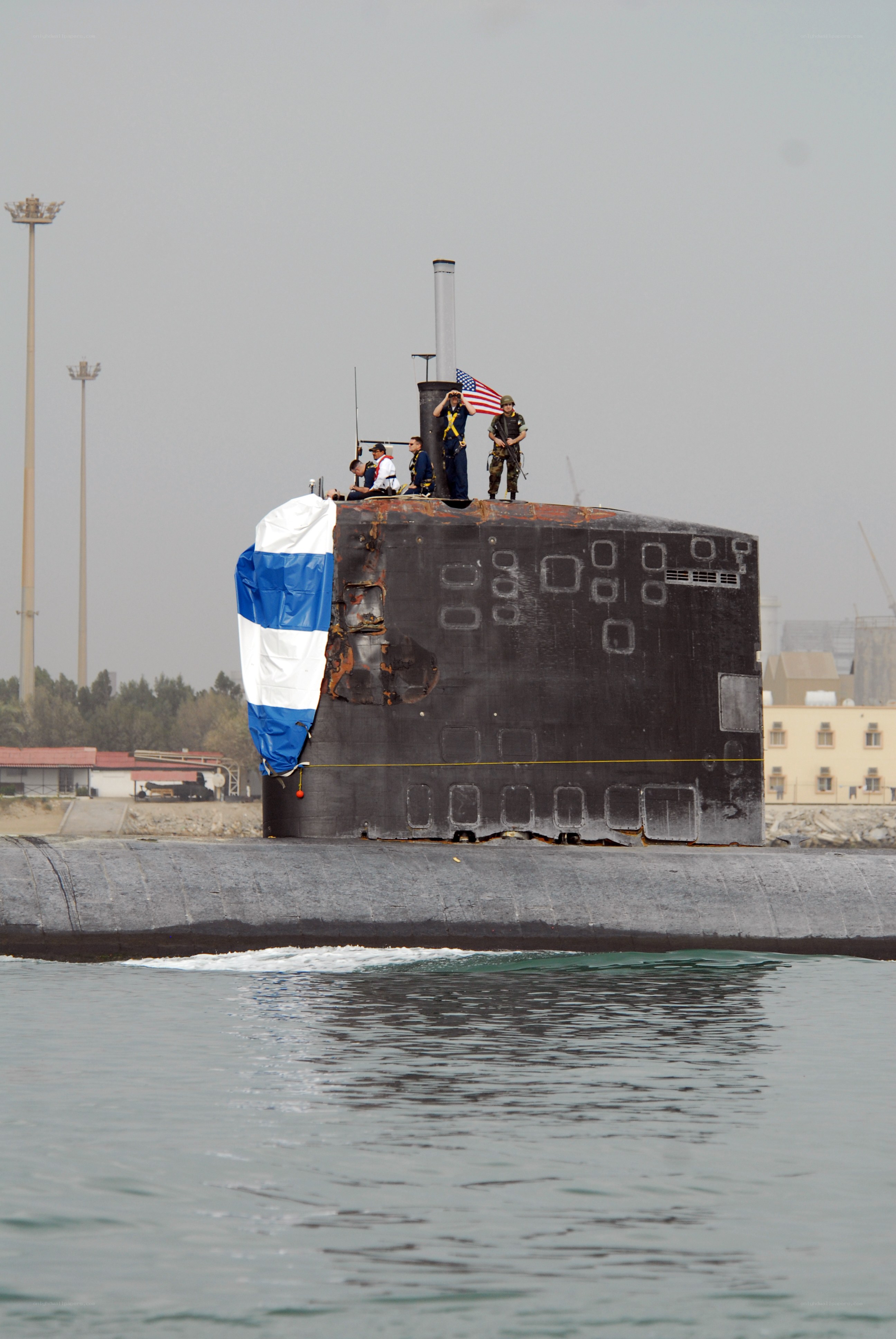 Submarine at port with crew