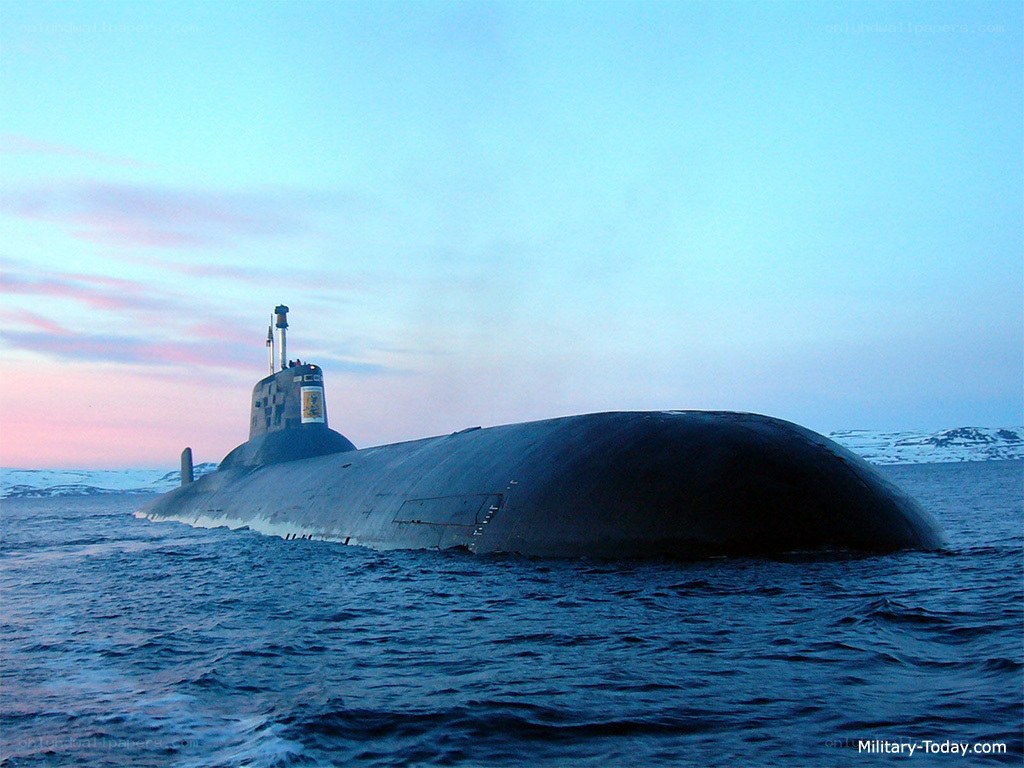 Submarine at sea during sunset