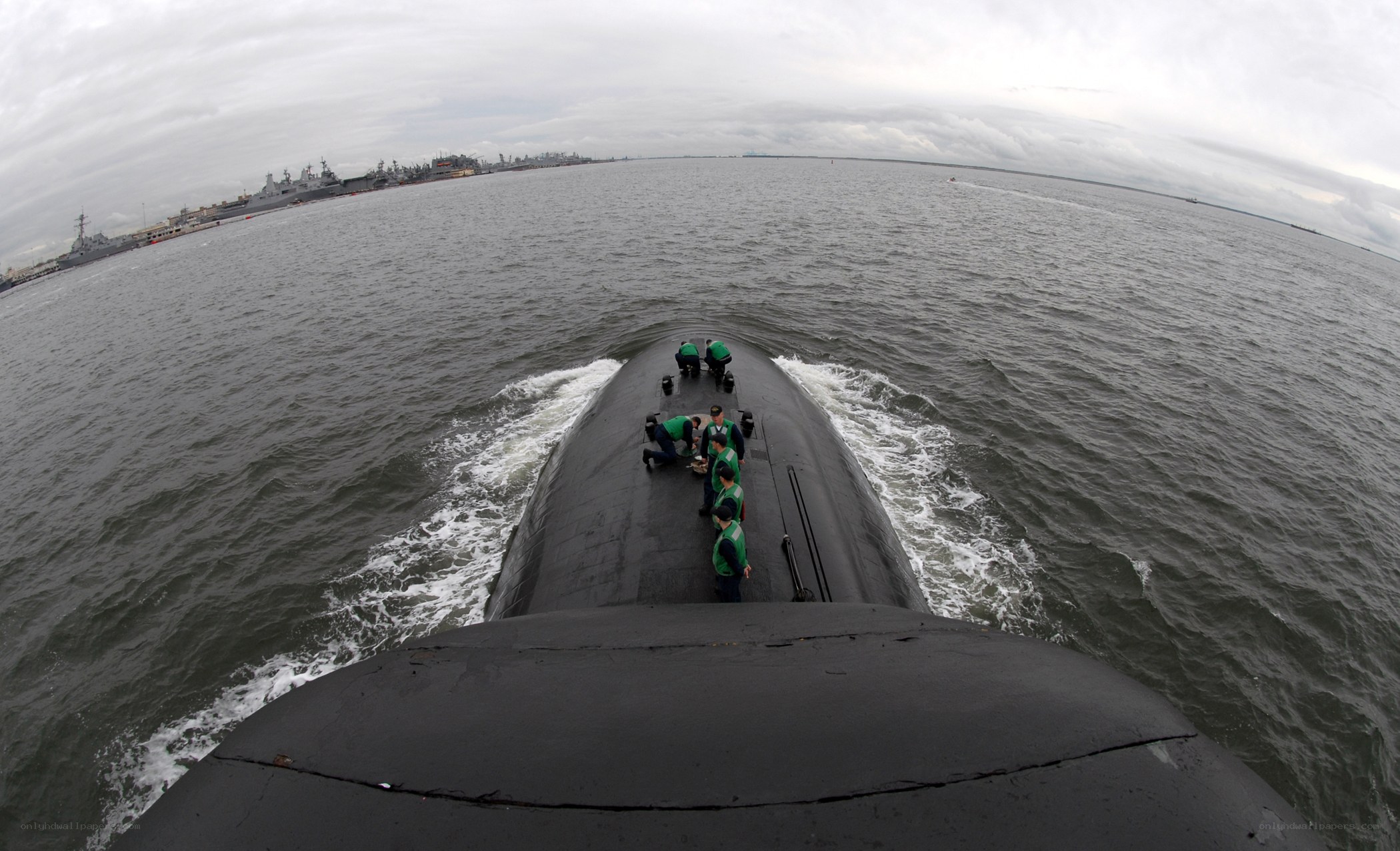Submarine at sea with crew