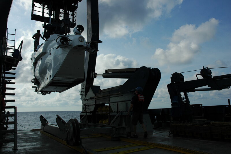 Submarine being lifted on a ship